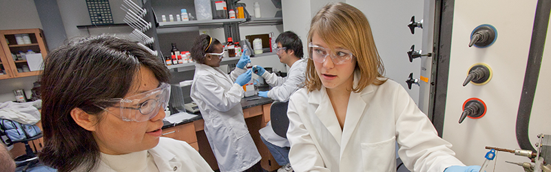 Two students researching a project in a science lab.