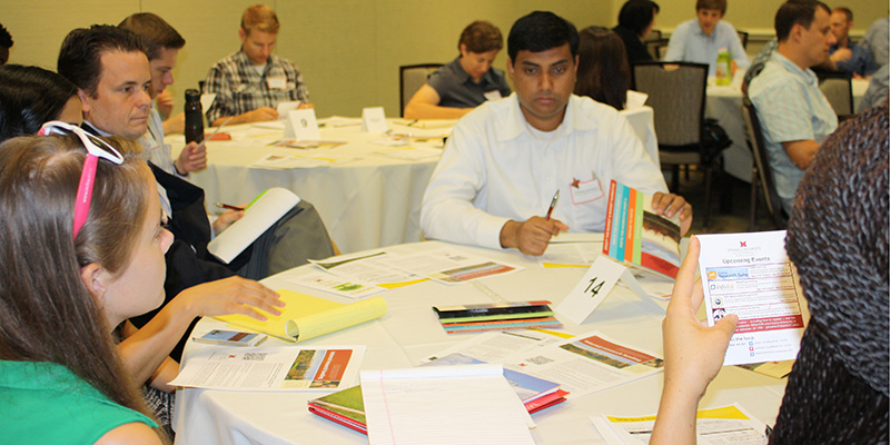 Image of several new faculty doing group work at New Faculty Orientation
