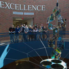 Talawanda High School students looking at the new sculpture