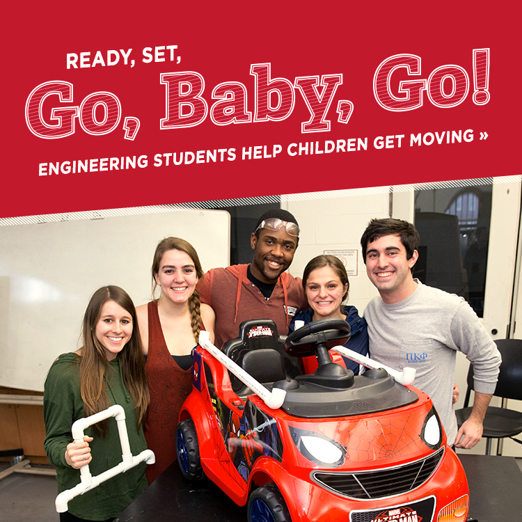 Ready, set, go, baby, go! Engineering students help children get moving » Photo of a group of 5 students posing with a battery-powered spiderman-themed kid-sized car modified to help children with mobility disabilities get around