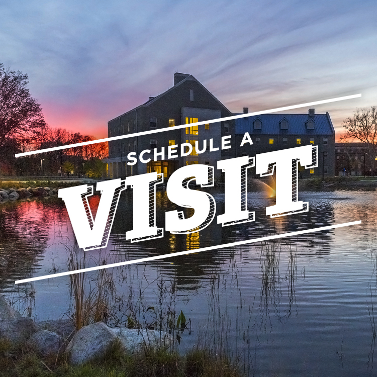 Schedule a Visit. Photo of a residence hall reflected on a pond at sunset.