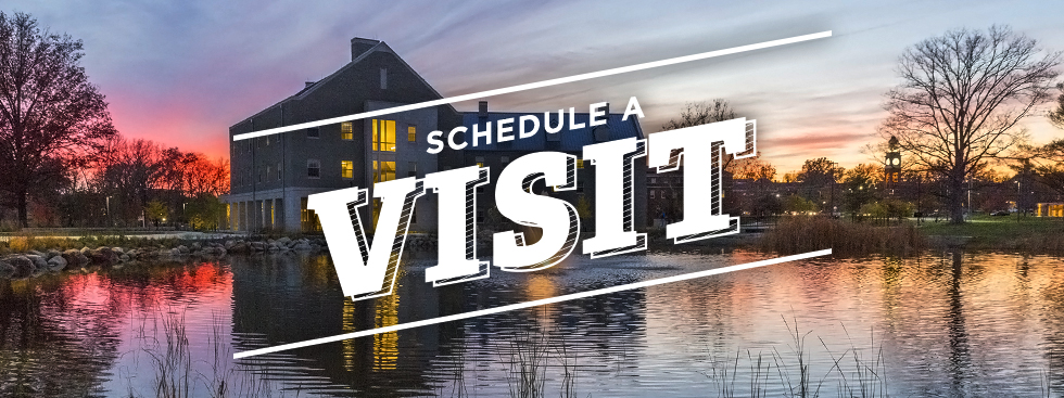 Schedule a Visit. Photo of a residence hall reflected on a pond at sunset.