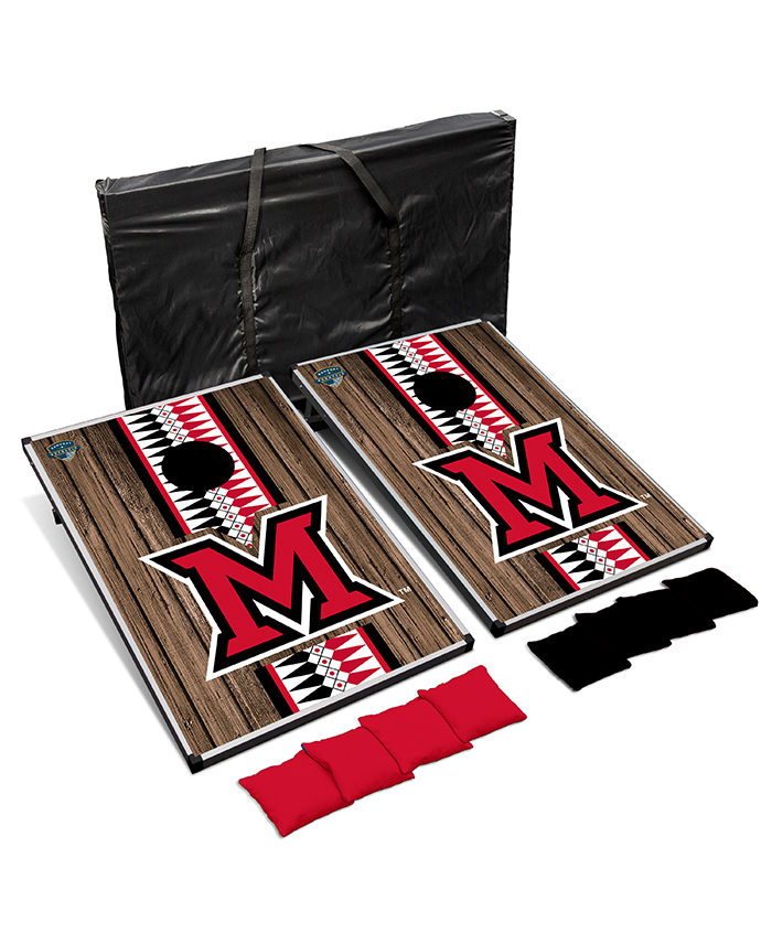 A cornhole set with a large Miami beveled M and a vertical stripe filled with the ribbonwork pattern.
