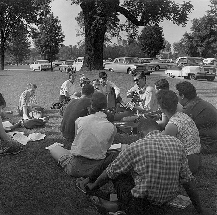 Volunteers sing freedom songs on the lawn in front of Clawson Hall in 1964.
