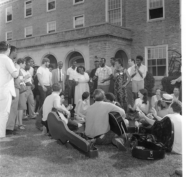 Freedom Summer workers and volunteers gather to sing outside of Presser Hall