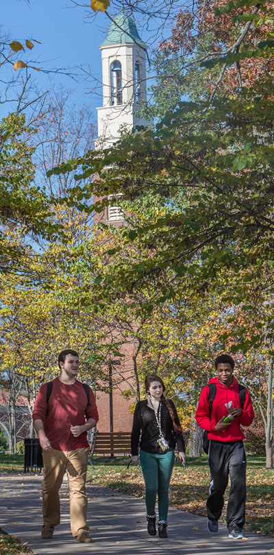 Students walking near Miami's Bell Tower.