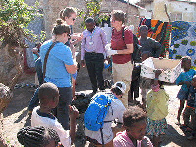 Students sample water in urban community.