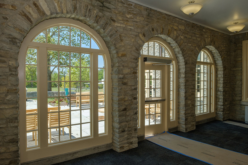 A newly enclosed sunroom leads to an outside patio at Clawson.