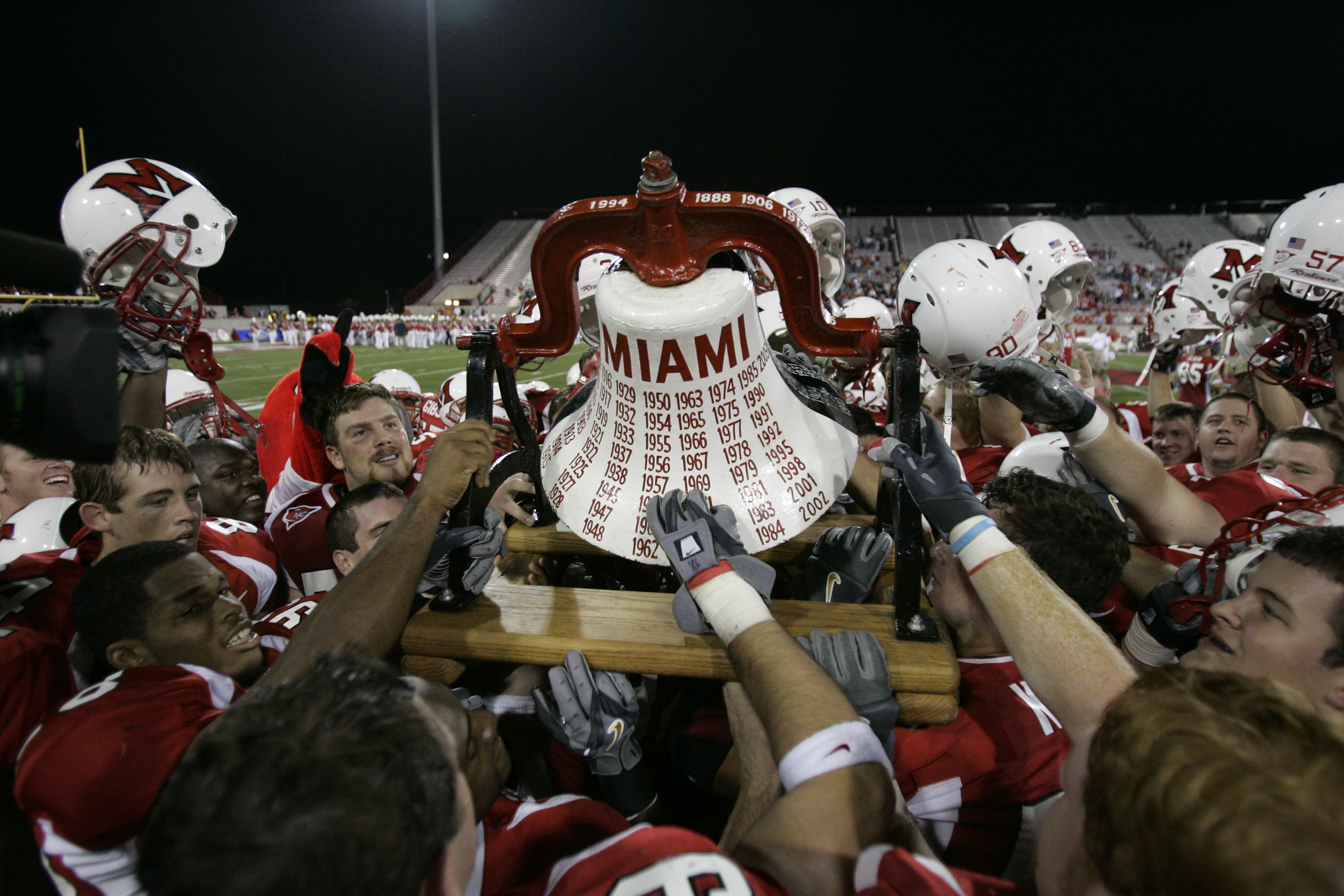 Miami players with the Victory Bell