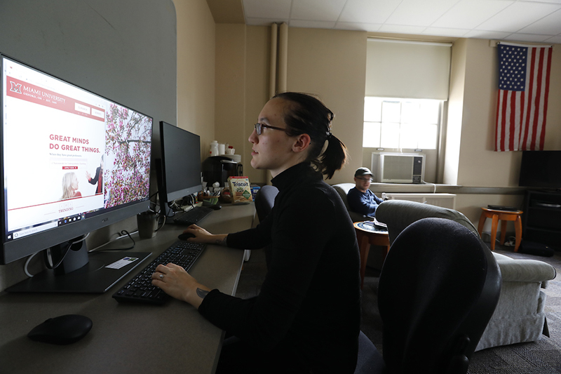 Emma Wott, chair of the Student Veterans Association, uses a computer in the Student Veterans' Center.