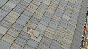 Photo of roof shows a broken tile