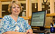 Smiling nurse at her computer station
