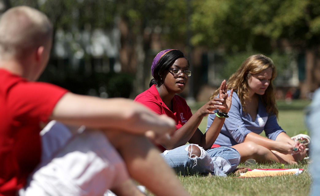 Small groups gather outside dorms and living-learning communities and share like interests.