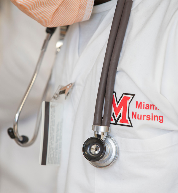 Miami nursing student wearing a mask and stethoscope
