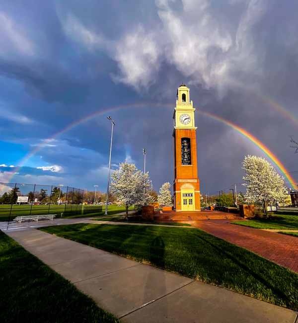 rainbow over tower on campus