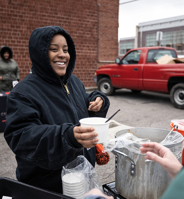 Miami students participated in a recent food distribution event sponsored by the Walnut Hills Redevelopment Foundation
