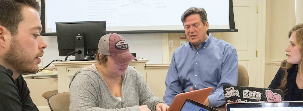 FSB professor Wayne Speers working with students in his classroom