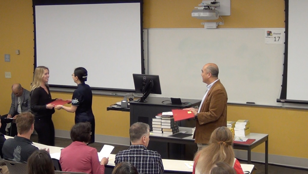 Students receive the Outstanding Student Awards