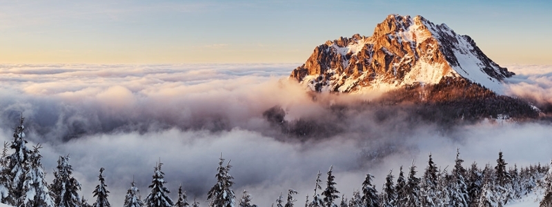 A mountain peers through the clouds in Slovakia