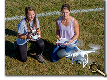 enlarged photo of students with drone