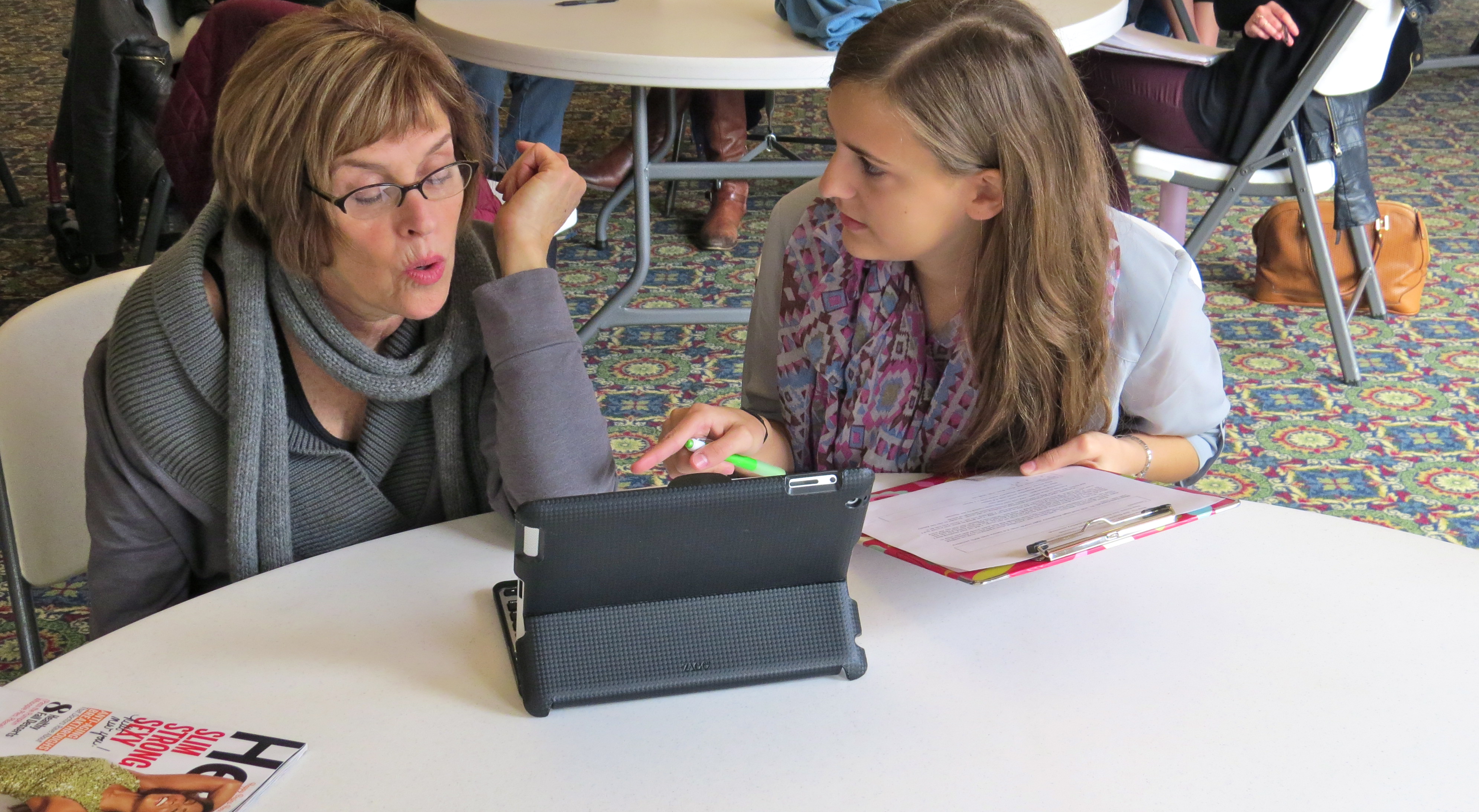 Clinician doing adult therapy with an iPad