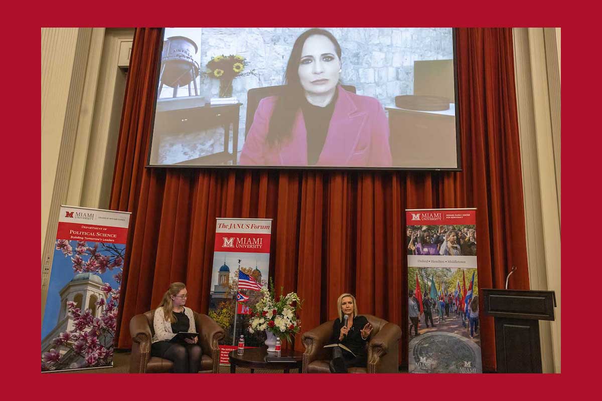 Johanna Maska (seated, right) and Stephanie Grisham (monitor via Zoom) spoke at the November 2022 Janus Forum in the Farmer School of Business's Taylor Auditorium about the current state of abortion rights.
