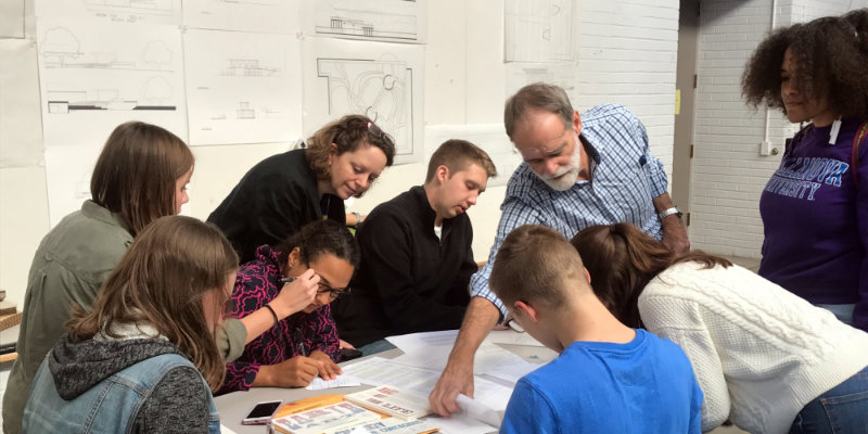 Faculty and students interact during a studio session