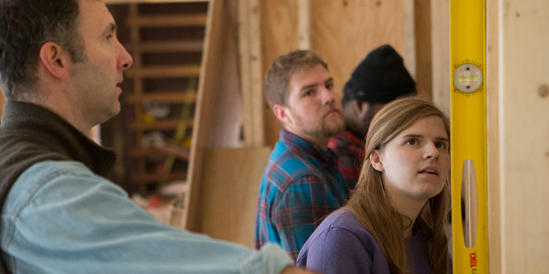 John Blake and a student view a level inside an Over-the-Rhine building project