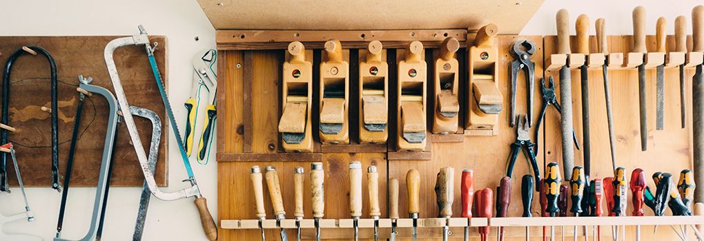 A wall of architectural and building tools
