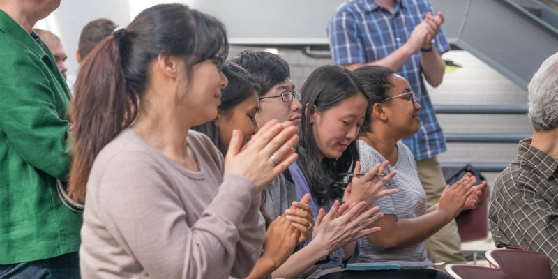 Students applaud the 2016 thesis presentations