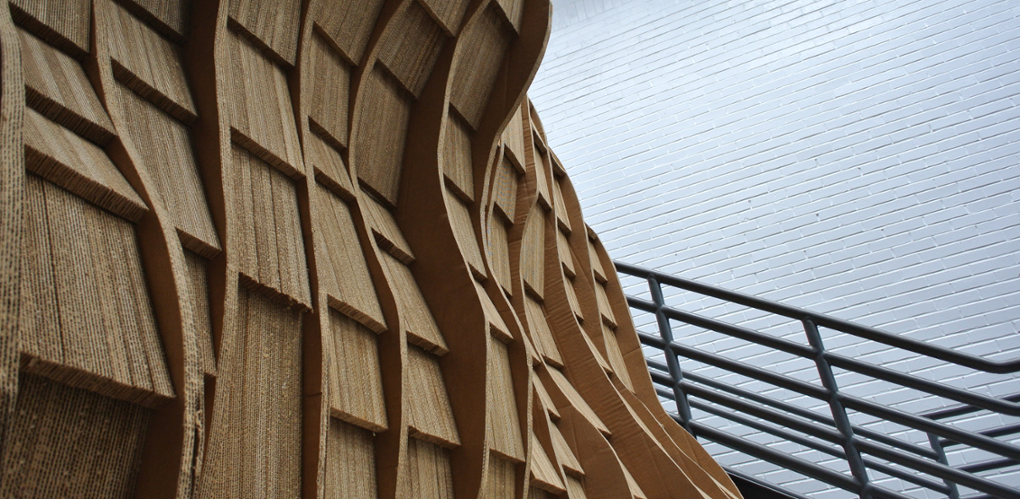 Curved brown wall and stairs in Alumni Hall