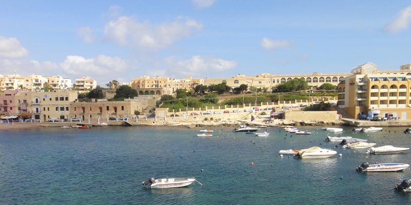 Seaport in Malta, with buildings and small watercraft