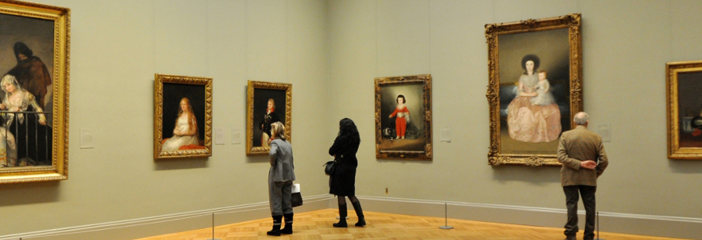 Patrons look at European Art in the Metropolitan Museum of Art in NYC