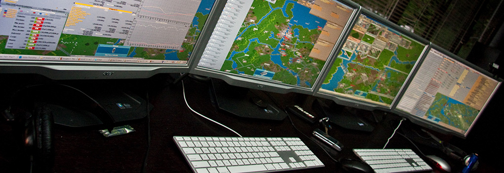 Computer monitors display a game