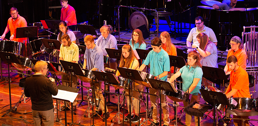 Miami Steel Drum Band students performing on a stage