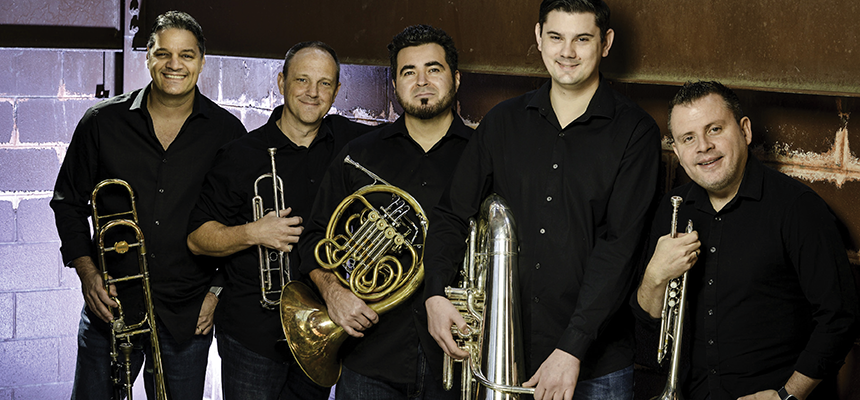 Members of Boston Brass pose with their instruments