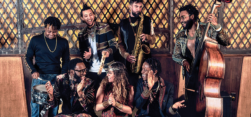 Musicians from the Harlem 100 event sing, clap, and play instruments together