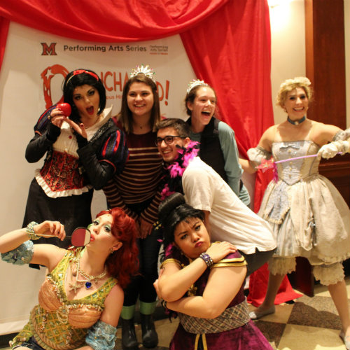 The princesses with audience members in photo booth