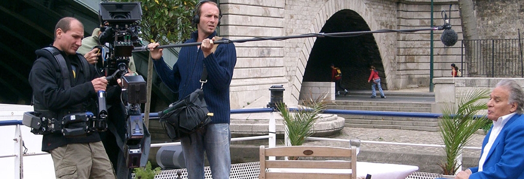 A camera operator and boom operator recording a scene