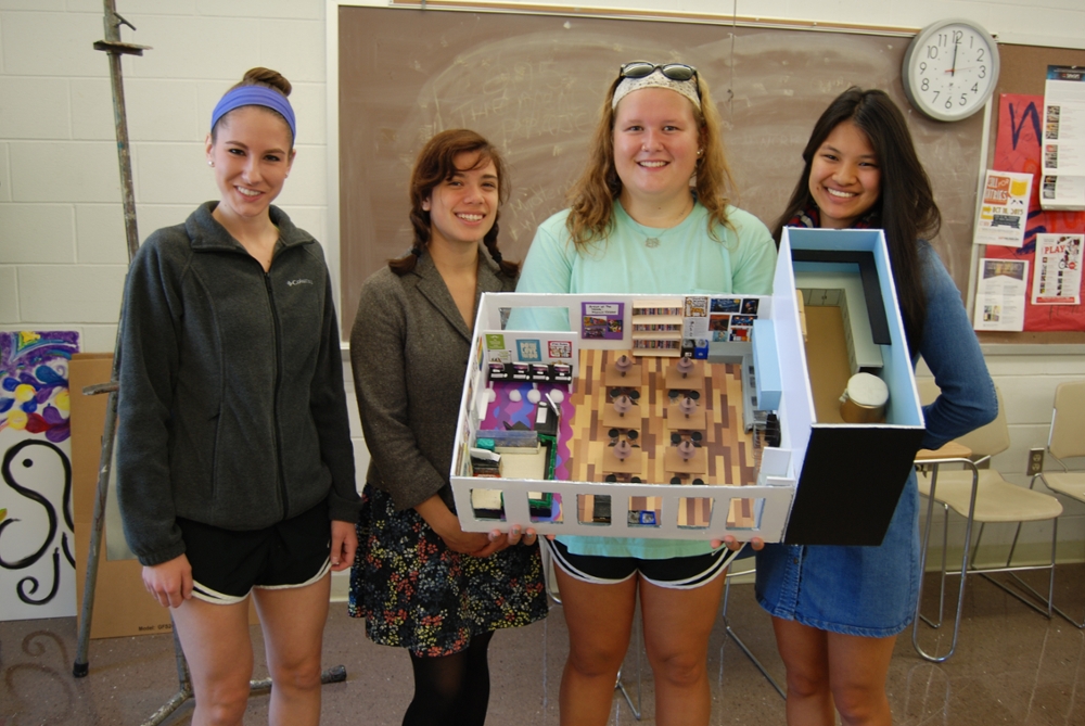 Remy Groh, Ryan Lott, Lucia Plaza-Trejo, and Emilee Scharf with artwork