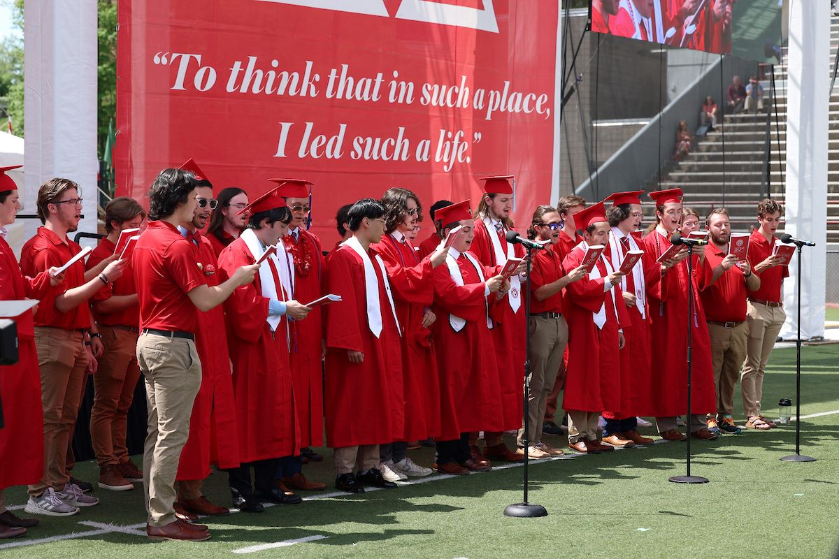 Graduating members of the men's glee club sing the alma mater