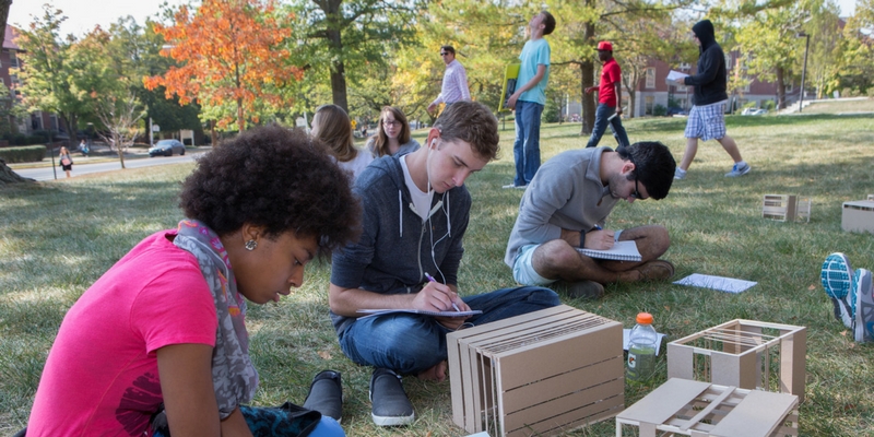 students outdoors working on a project
