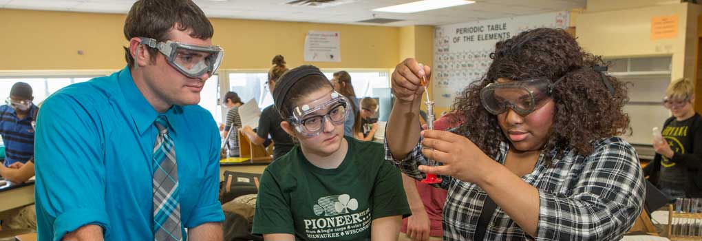 three students in a lab