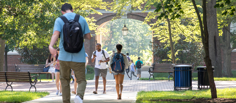 students walking on campus in the fall