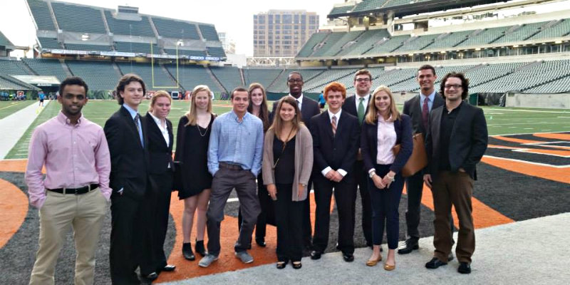 SLAM students taking a picture on the field at Paul Brown Stadium