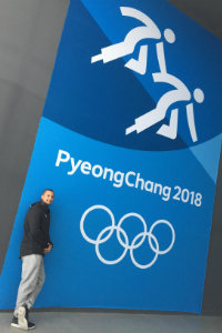 Dustin Woods takes picture with pyeongchang logo