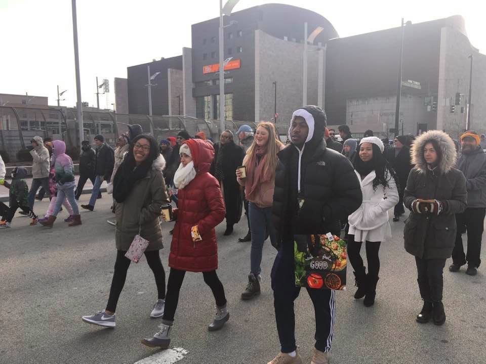 Eight students walk in the Martin Luther King Jr Day Justice March.