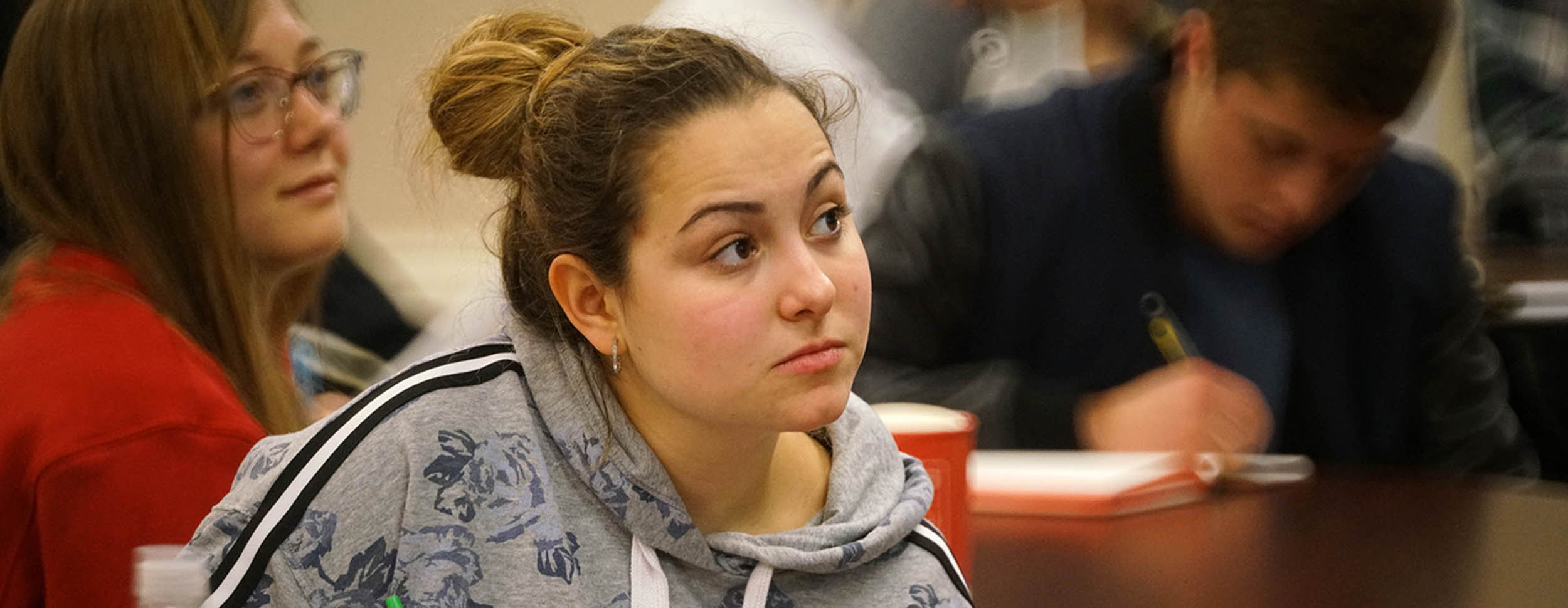 Student watches lecture speaker