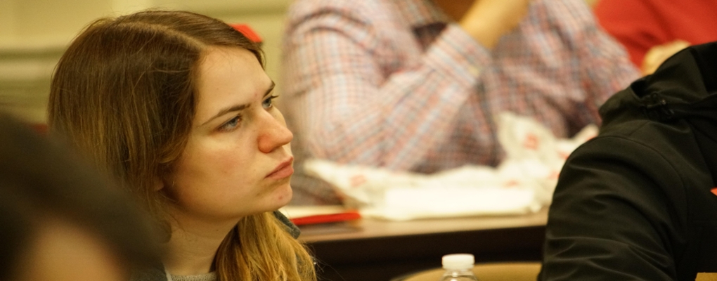 Student in class listens to lecture