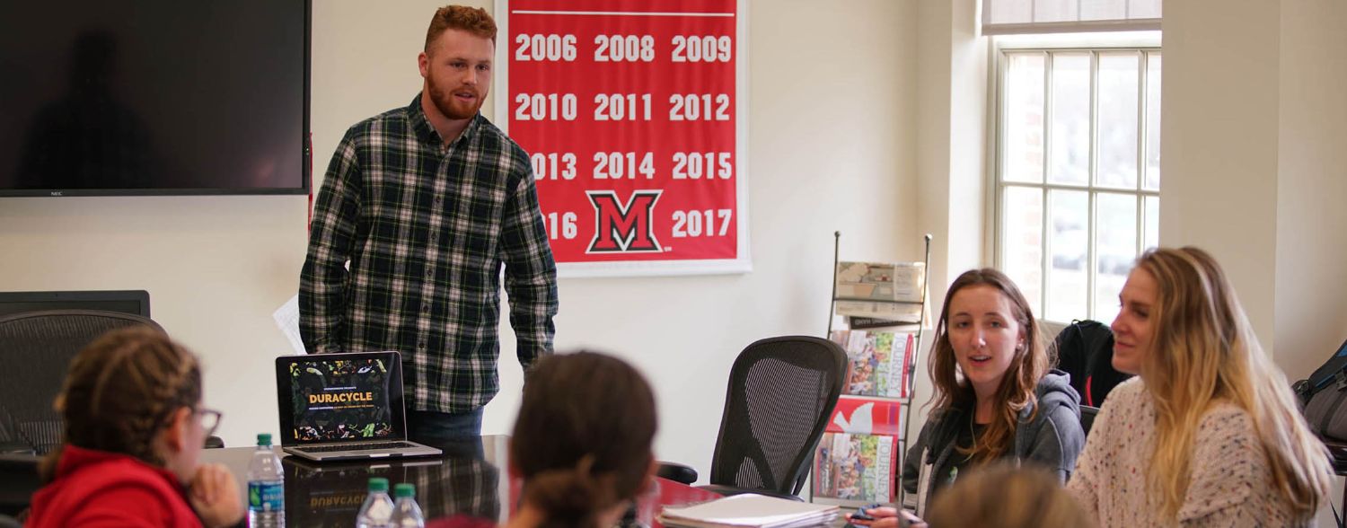 A student pitches their idea for a business at the Open Mic Lunch
